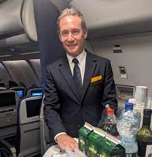 Jens Ritter working with the crew on a Lufthansa flight.